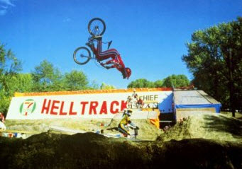 BMX biker doing a flip off a ramp