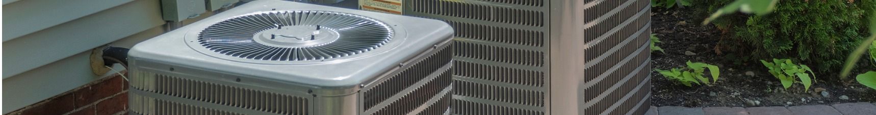 AC unit with a fan on top outside